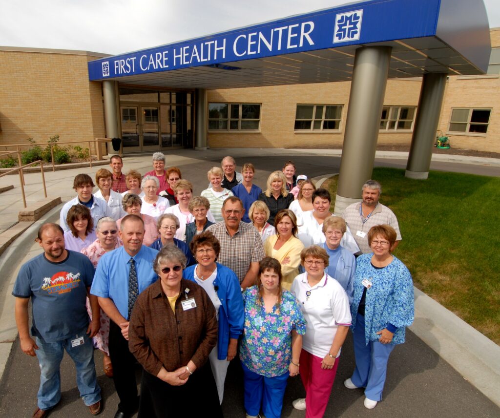 First Care Health Center - group of people standing outside building